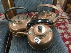 3 copper kettles.