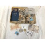 A box of foreign coins and bank notes.