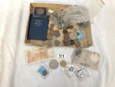 A box of foreign coins and bank notes.