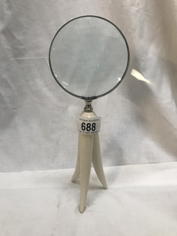 A magnifying glass on plastic stand.