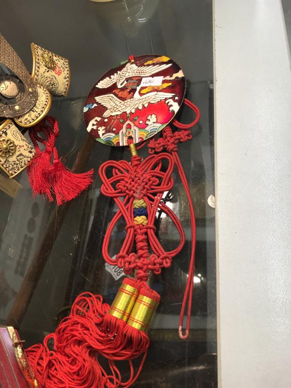 A Japanese Samourai 'Kabuko' dolls helmet, a metal and silk sash, an 'Orb-it game and stress balls. - Image 4 of 4