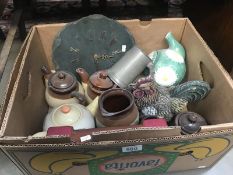 A box of miscellaneous items including chicken door stop, slate door stop, pewter tankard etc.