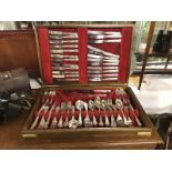 A 12 place setting silver plated King's pattern canteen of cutlery in a brass bound mahogany box.