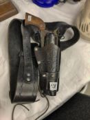 A German made 'Western' revolver with leather holster and case.