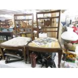 A pair of mahogany inlaid nursing chairs.