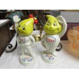 A pair of cast iron Esso figures.