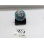 A small tin plate pocket globe.