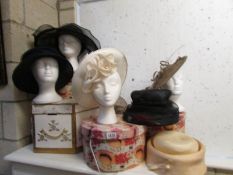 A quantity of vintage hats and boxes (heads not included).