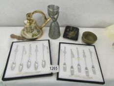 2 boxed sets of Japanese music related spoons & forks, a brass bell, a flagon with cup,