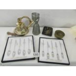 2 boxed sets of Japanese music related spoons & forks, a brass bell, a flagon with cup,