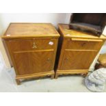 A pair of mahogany veneered bedside cabinets.