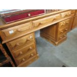 A pine double pedestal desk.