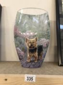 A large art glass vase depicting a Yorkshire terrier.