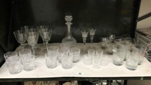 A shelf of drinking glasses.