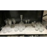 A shelf of drinking glasses.