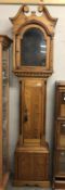 An arched top pine Grandfather clock case.