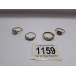 4 gold rings set with various stones, hall marks worn, approximate total weight 8 grams.