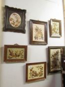 A quantity of Edwardian framed and glazed collages of dried flowers.