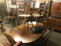 An Ercol dining table and 6 Ercol dining chairs.