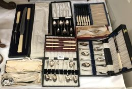 A cased carving set, cased set of grapefruit spoons,