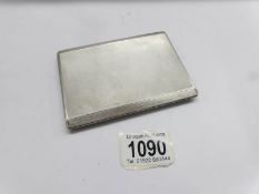 A silver cigarette case, hall marked Birmingham 1941. W.T.Toghill & Co., Approximately 166 grams.
