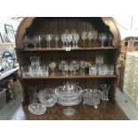 A large quantity of glassware including bowls, vases, cake stand etc.