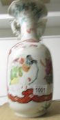 An oriental hand painted vase.