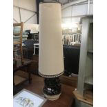A large 1970s pottery table lamp with tall shade.