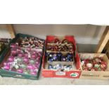 A box of over 140 Christmas tree ornaments and baubles.