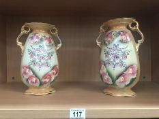 A pair of Staffordshire vases.