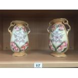 A pair of Staffordshire vases.