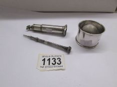 A silver napkin ring, Birmingham 1944/45, A silver perfume bottle, a/f and a silver pencil.