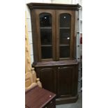 A Victorian mahogany corner cupboard.