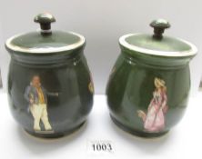 A pair of 19th century T & G pottery Dicken's themed tobacco jars.