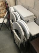 A set of plastic folding chairs and tables.