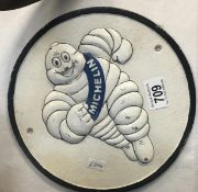 A round cast iron Michelin sign.