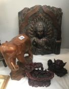 A carved wood elephant, resin wall plaque and 2 oriental style resin ornaments.