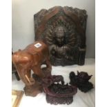 A carved wood elephant, resin wall plaque and 2 oriental style resin ornaments.