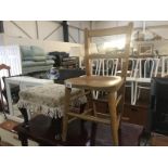 An old oak childs' school chair and a footstool.