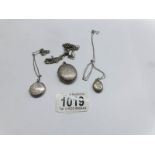 3 silver lockets on silver chains.