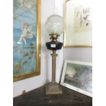 A brass Corinthian column oil lamp with glass font and acid etched shade.