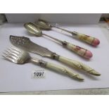 A pair of superb quality silver plated fish servers and a pair of salad servers with ceramic