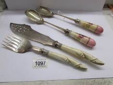 A pair of superb quality silver plated fish servers and a pair of salad servers with ceramic