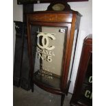 A mahogany inlaid cabinet with stencilled lettering to doors.