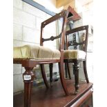 A pair of mahogany dining chairs.
