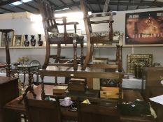 An extendable dining table with 6 gothic carved dining chairs (includes 2 carvers).