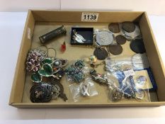 A mixed lot of costume jewellery including silver rings, coins, badges etc.
