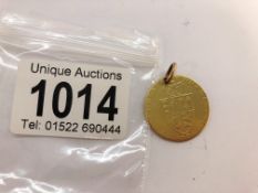 A George III gold guinea as a pendant (9 grams).