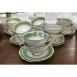 12 Paragon soup bowls and saucers with green and gold decoration.