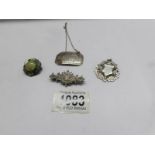 A silver brooch, a silver fob, a stone set silver brooch and a silver 'Madeira' wine label.